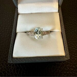 Oval aquamarine w/round white zircon rhodium over sterling. Sz 7.
